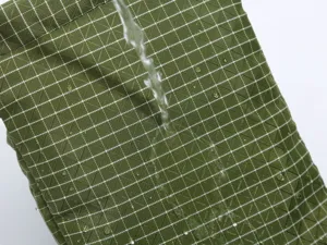 Waterproof grid fabric detail of Korean style fashion casual outdoor sports shoulder bag.