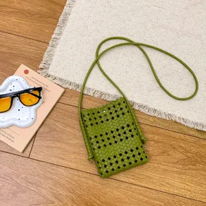 Green woven crossbody bag for women, stylish hollow out shoulder phone bag with slim strap.