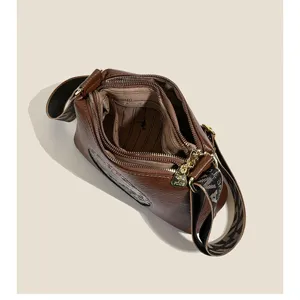 Detailed top view of a stylish brown PU leather shoulder bag featuring multi-compartments.