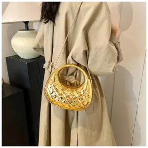 Shiny metallic gold quilted handbag with rigid round handle and chain strap for women.