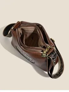 Retro brown PU leather multi-zipper crossbody shoulder bag for women, top view display.