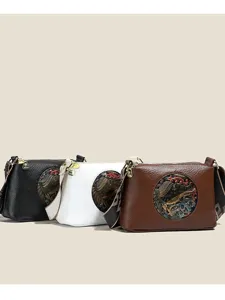 Retro ethnic style PU leather shoulder bag for women, trendy elephant embossed design crossbody.