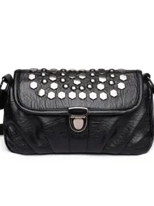 Black leather shoulder bag for women, stylish crossbody handbag with metal studs and lock.