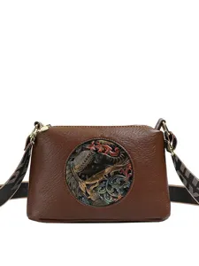 Retro ethnic style PU leather crossbody shoulder bag with unique embossed elephant design.