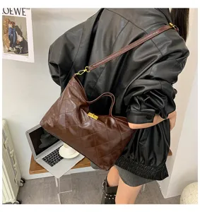 Vintage quilted shoulder bag for women, stylish brown tote bag with metal lock and strap.