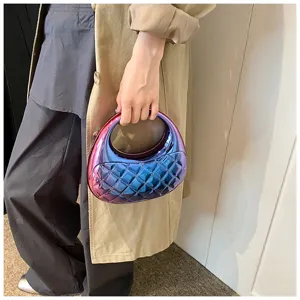 Detailed view of the gradient metallic quilted acrylic handbag with round handle design.