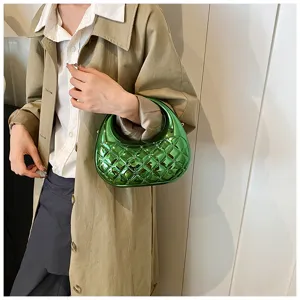 Green metallic quilted acrylic evening bag, stylish curved hobo handbag for women autumn fashion.