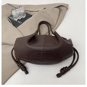 Brown nappa leather handbag with stylish drawstring knot handles, elegant and compact design.