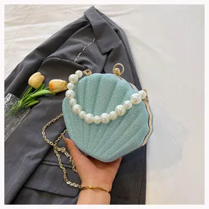 Pearl handle shell evening bag, stylish blue sparkling clutch with gold chain for women.