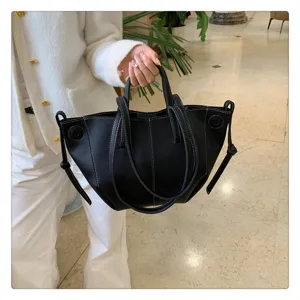 Stylish black leather pleated tote bag for women, perfect for daily shopping and casual use.