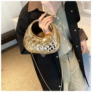 Gold quilted acrylic hobo crossbody bag, chic metallic finish evening handbag with chain strap.