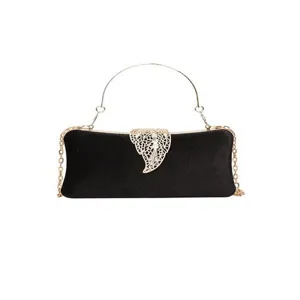 Black velvet evening clutch bag with gold chain strap and elegant hollow leaf clasp design.