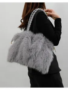 Stylish gray faux fur shoulder bag for women, large capacity fluffy tote with braided strap.