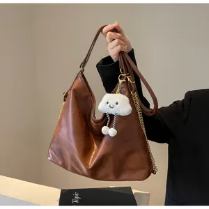 Brown soft leather hobo shoulder bag with chain strap and cute cloud pendant for women.