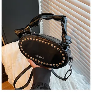 Black PU leather oval rivet shoulder crossbody bag, detailed view showing cloud gathered handle.