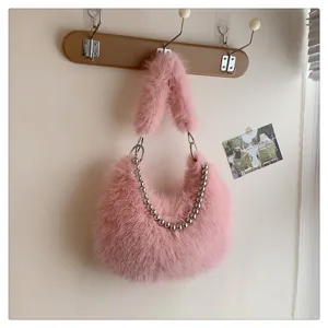 Pink faux fur shoulder bag detail, fuzzy underarm purse featuring stylish metal ball chain.