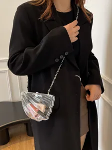Transparent acrylic shell crossbody bag with metal chain strap, cute mini shoulder bag for women.