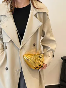 Gold acrylic shell clutch bag with metal chain strap for women, trendy niche design evening bag.