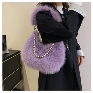 Detailed view of the purple faux fur shoulder bag with metallic bead chain, soft and stylish.
