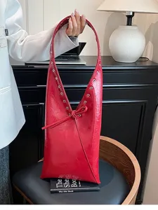 Vintage red hobo shoulder bag for women, PU leather retro underarm tote with chic grommets.