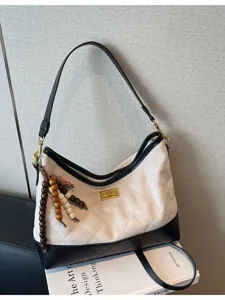 Borsa a tracolla trapuntata in camoscio rétro da donna, elegante borsa hobo bicolore.