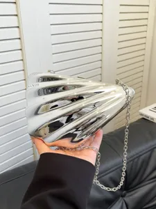 Silver metallic shell acrylic clutch bag detail view with chain strap and metallic finish