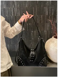 Black large capacity shoulder underarm tote bag with metal buckle and rivet decor.