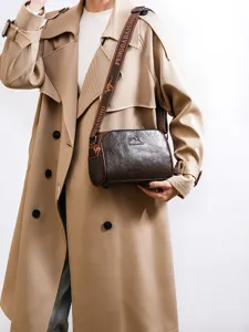 Vintage brown cross-body bag for women, stylish pillow shoulder bag with strap.