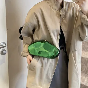 Stylish green acrylic meteorite clutch bag with metal chain strap, unique irregular design for women.