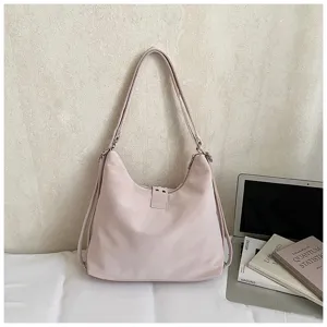 Close-up detail of the elegant pink large-capacity shoulder tote bag with minimalist design.