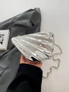 Silver metallic shell clutch bag with chain strap fashion evening shoulder handbag detail view
