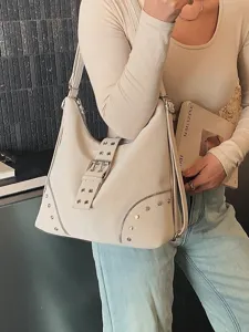 Chic beige shoulder bag for women, large capacity hobo bag with stylish buckles and metal studs.