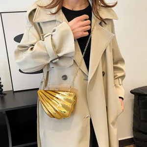 Gold acrylic shell crossbody bag for women, stylish clutch with metal chain strap.