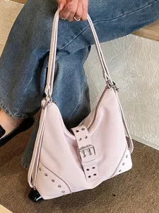 Pink slouchy shoulder bag for women, stylish hobo tote with metal buckle and soft leather.