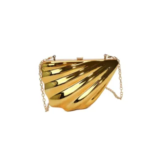 Gold shell acrylic evening clutch bag with metal chain strap for women fashion party daily.