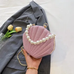 Pink glitter shell evening bag with pearl handle and chain strap for women party wedding.
