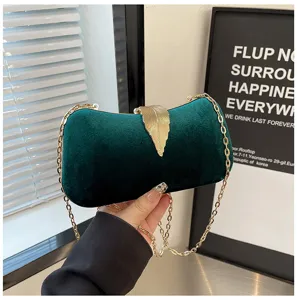 Elegant dark green velvet evening clutch bag with gold leaf clasp and metal chain strap.