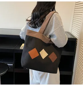 Casual large capacity canvas shoulder tote bag for women daily school use and shopping.