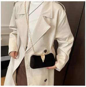 Black velvet evening clutch with gold chain and leaf clasp for party wedding banquet.