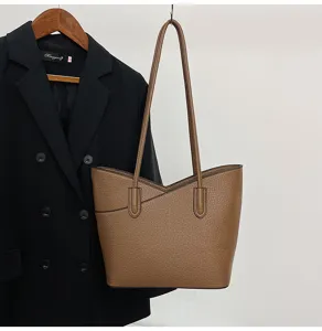 Elegant brown leather tote bag for women, large capacity shoulder bag for daily commuting.