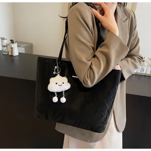 Women large capacity black tote bag, casual PU leather shoulder handbag with plush cloud pendant.