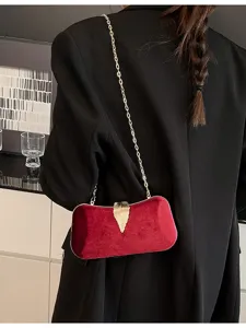 Elegant red velvet evening bag with gold chain strap and leaf clasp for women parties.