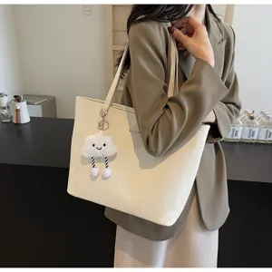 Detailed view of women's casual large-capacity tote bag featuring a cute plush cloud pendant.