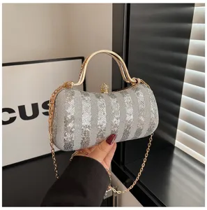 Sparkly sequin evening clutch bag with metallic top handle and chain strap for women party dress.