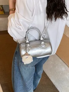 Silver metallic boston bag shoulder handbag with cute plush pom-pom charm daily style.
