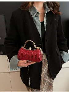 Elegant red sequin evening bag with gold chain strap, perfect for parties and formal events.