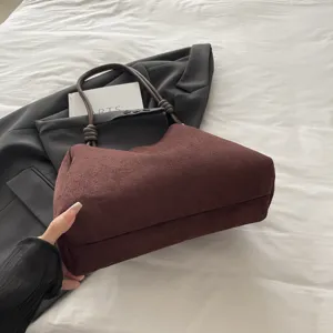 Dark brown suede shoulder tote bag with knotted handles, stylish large capacity for women.