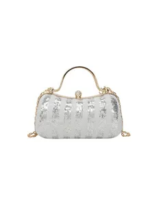 Elegant silver sequin evening clutch bag with gold handle and chain strap for women.