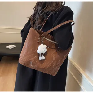 Stylish casual large capacity tote bag for women, commuter shoulder bag with cute cloud pendant.