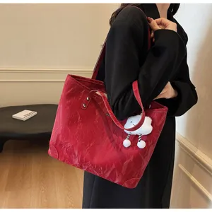 Stylish red pleated tote bag for women, large capacity shoulder handbag with cute cloud pendant.